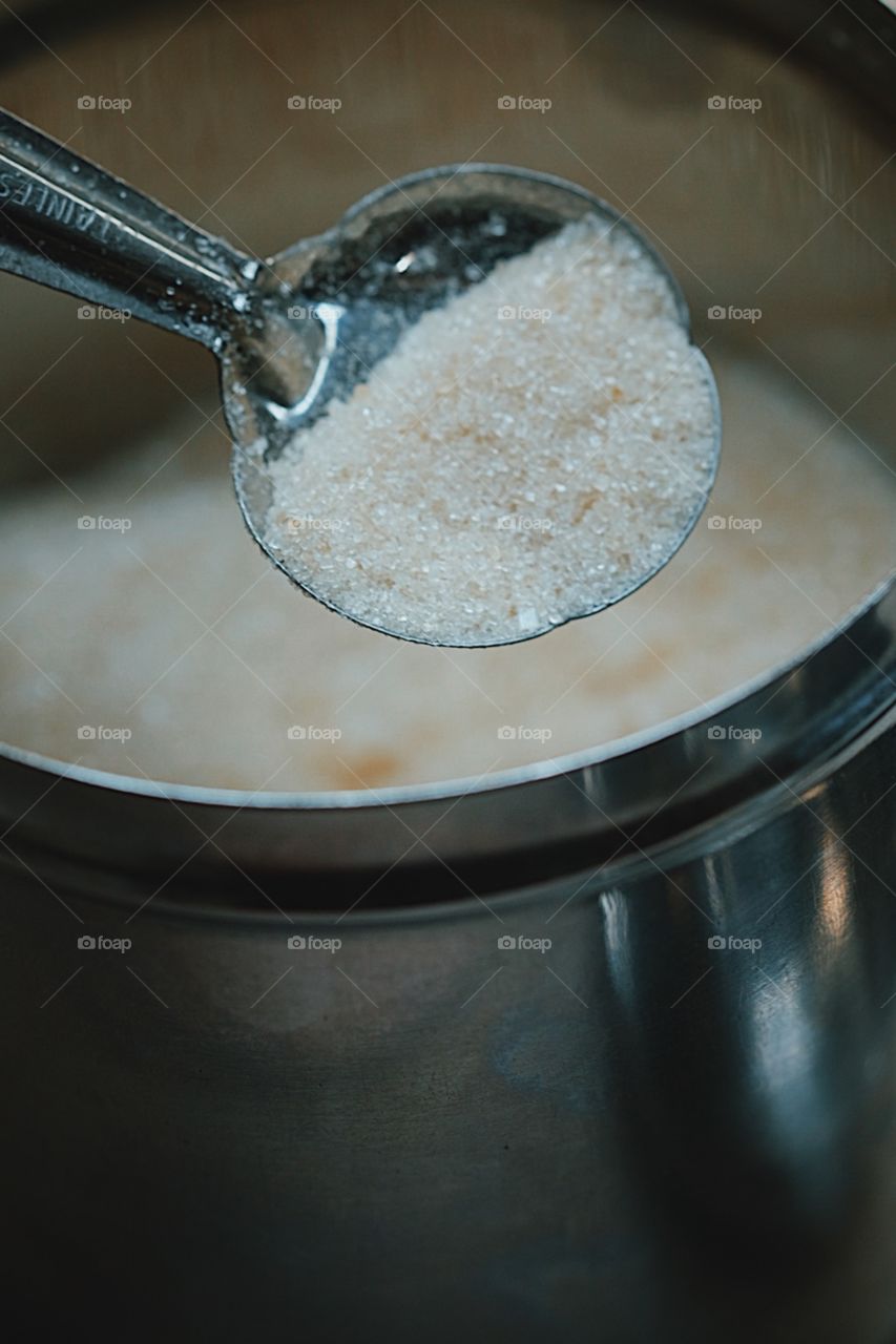 Sugar bowl, Woman scooping sugar out of sugar bowl, putting sugar into coffee, sugar bowl and spoon, organic sugar and spoon, sugar in sugar bowl, metal sugar bowl, fancy sugar bowl 