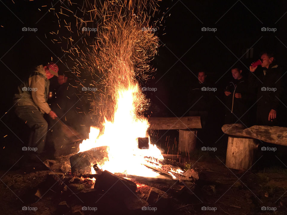 Stoking the campfire. Getting the fire going