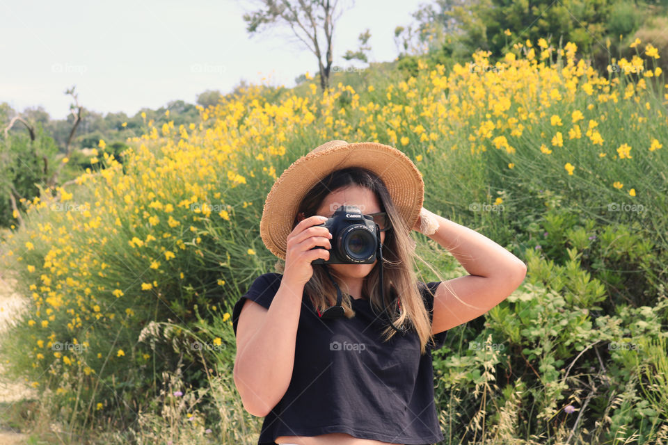 A girl holding a camera