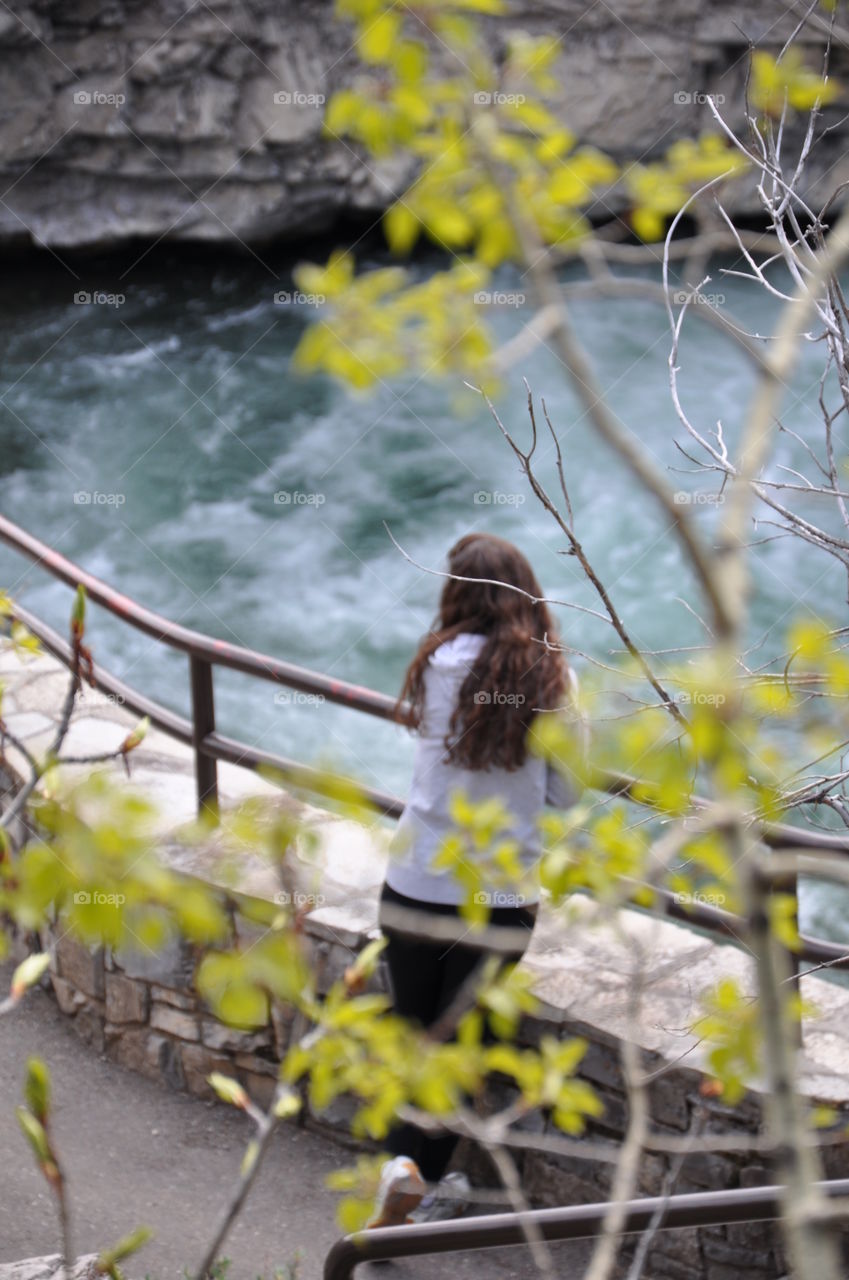 Girl watching river 