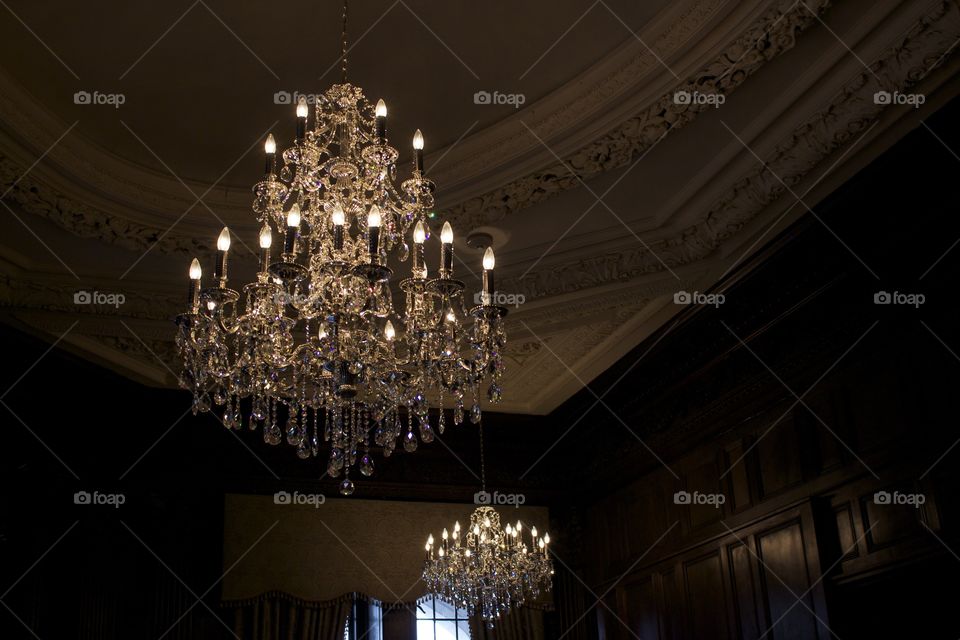 Illuminated chandelier in dark room