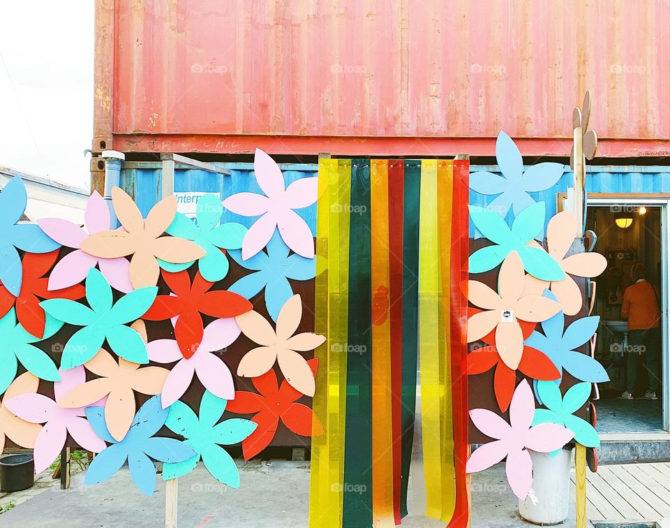 Rainbow colored forms on a building 