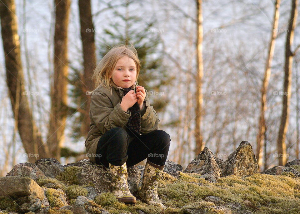 Girl sitting outdoors