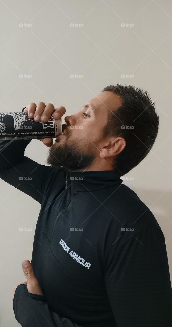 Asian handsome model ,drinking energetic drink