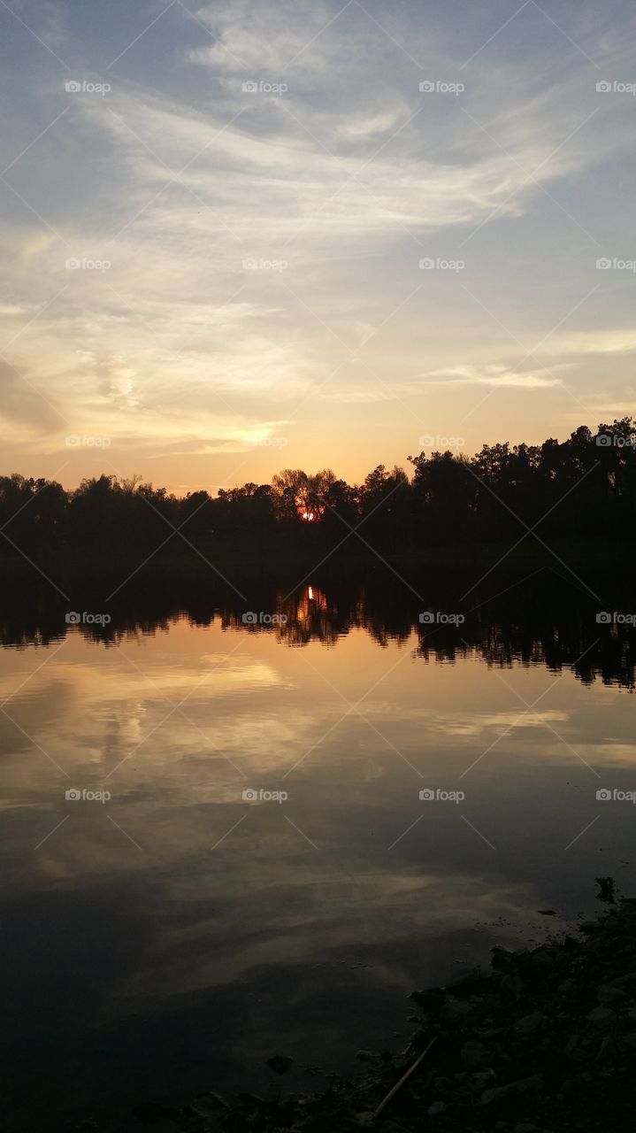 Reflection . sunset at the lake