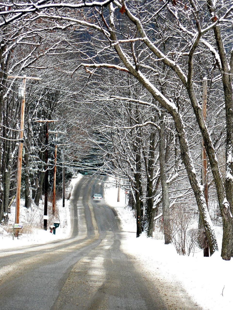 Winding winter roadway. An empty roadway after the first snow fall and winter