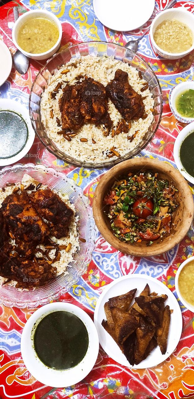 I wanted to share with you a picture of my favorite food, which is also molokhia with rice, chicken pieces, and appetizers, a wonderful mixed vegetable basket