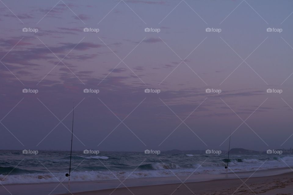 Fishing Rods at Sunset on the Beach