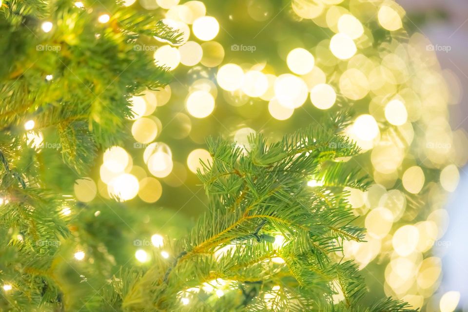 Christmas tree captured in selective focus. Bokeh holiday lights in the background. Bellagio Hotel and Casino on the Las Vegas Strip.
