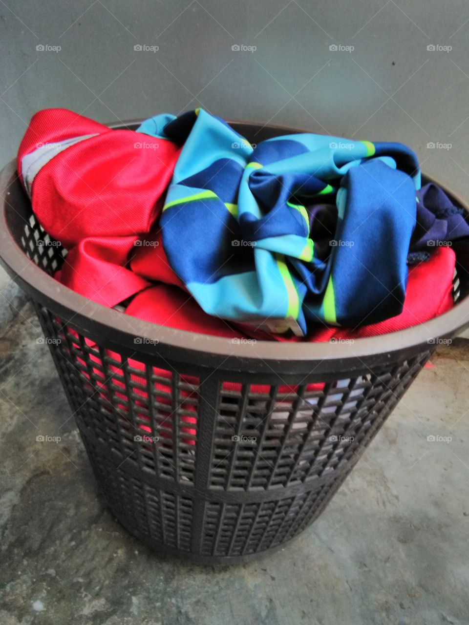 bucket full of dirty clothes