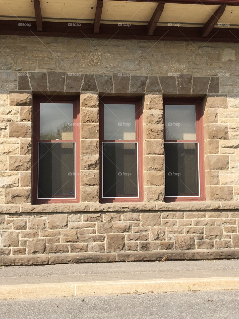 Brick wall with three windows 