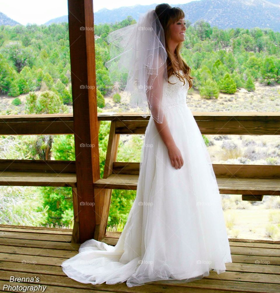 The Bride to be looking over the scenic location of her wedding.