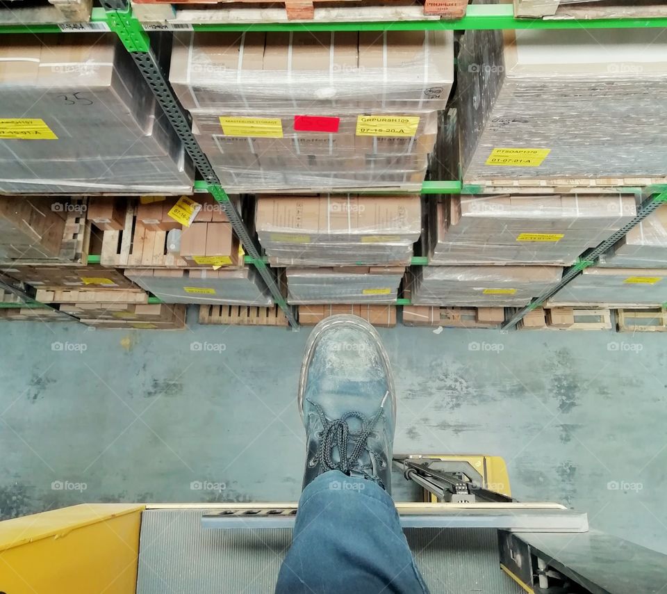 Working at heights. It's a long way down.work, warehouse, height, safety, factory, equipment, industry, construction, machine, job, workplace, industrial, emergency, employee, worker, health, ladder, engineering, storage, lift, machinery, transport,