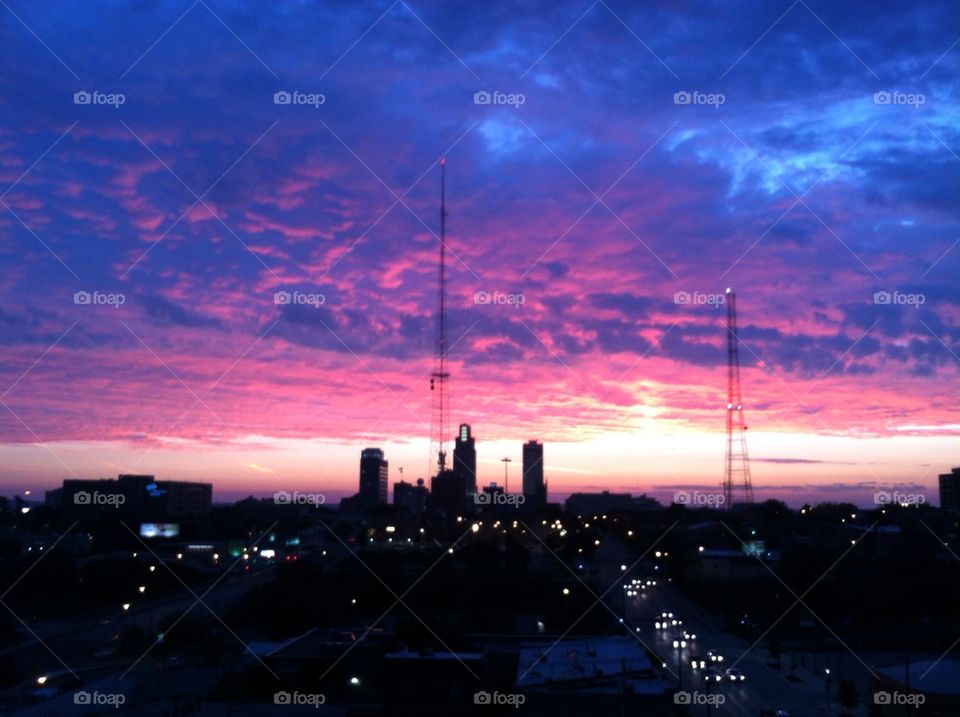 Sunrise over city skyline