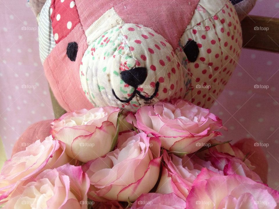 Old quilt teddy bear with pink roses