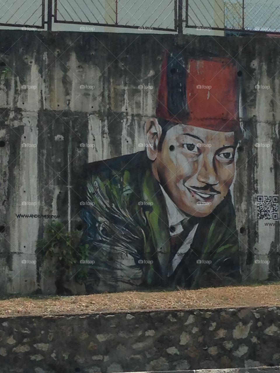 Iconic painting of P Ramlee. Road side painting of this iconic movie actor from the 50s - P. Ramlee rustic painting in Penang along the highway!