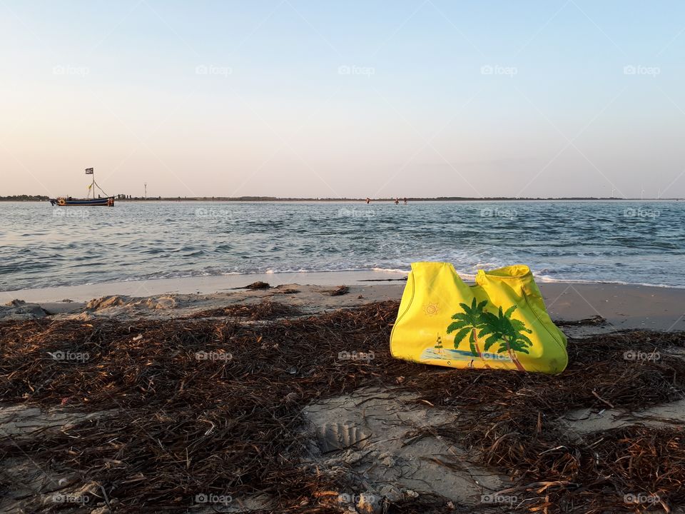 Green bag at the beach