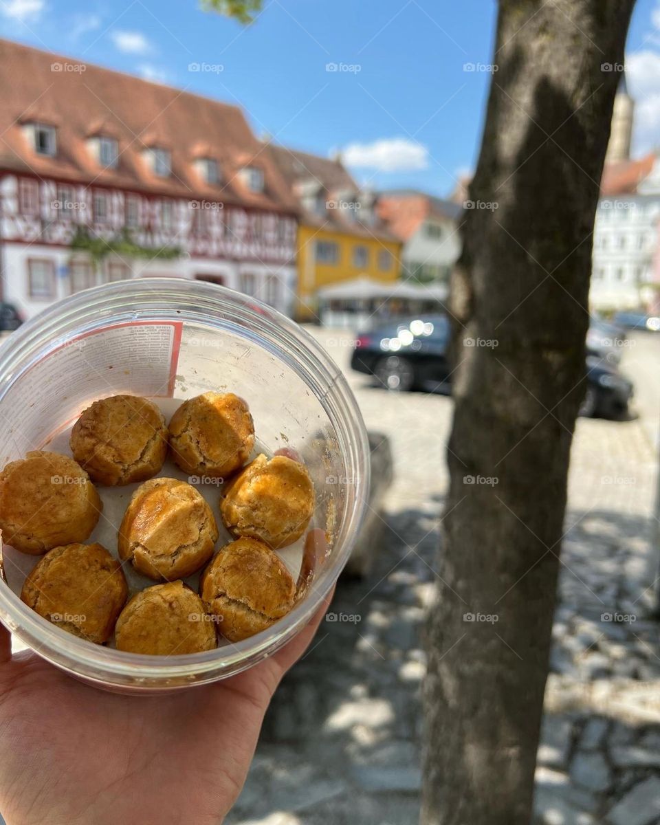 Chinese peanut cookies in front of traditional German housing background