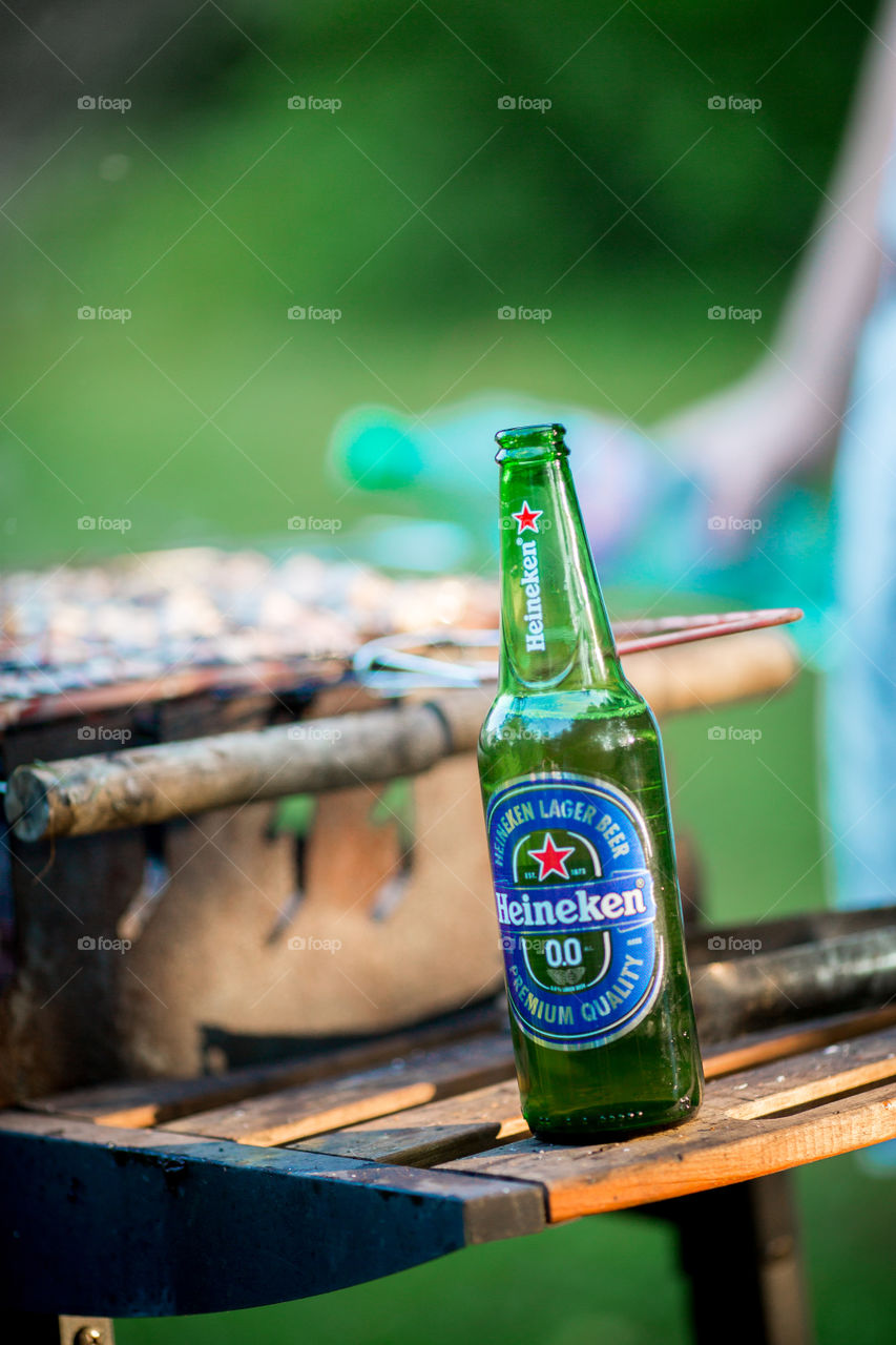 Nonalcoholic Heineken bottle  on picnic 