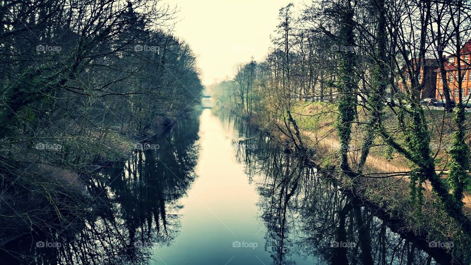 Reflexion on the river. Ilmenau river in Lüneburg, Germany 