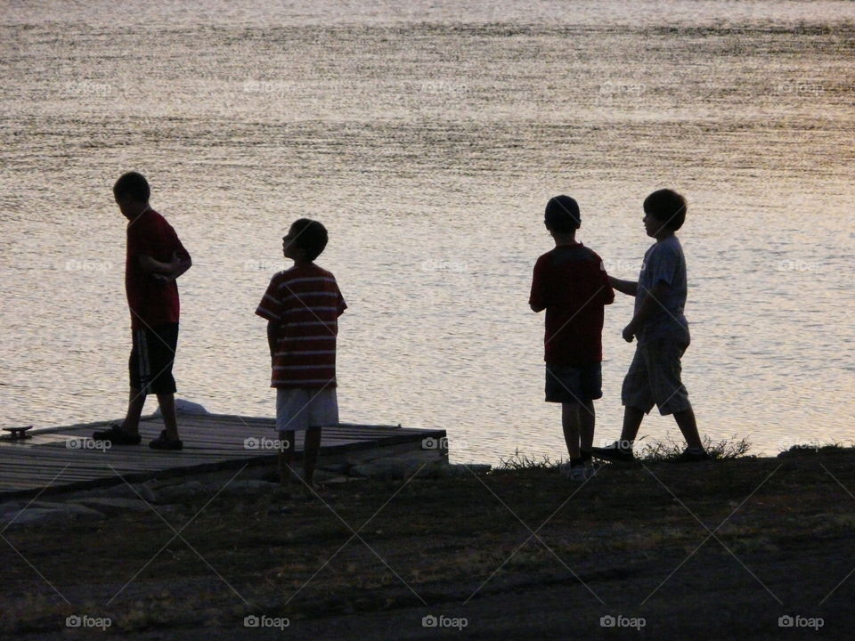 Boys at dawn ready to go fishing. 