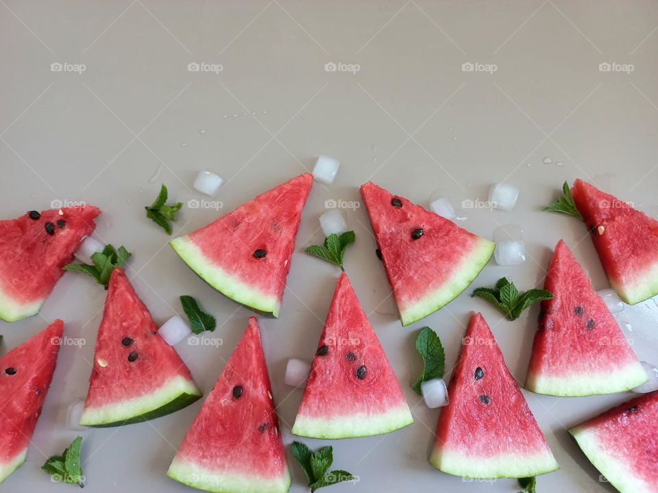 watermelon slices, ice cubes and mint.