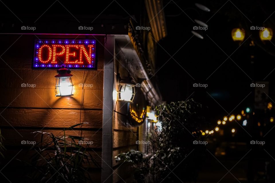 Open side lit up in the night in a small town with a old decor 