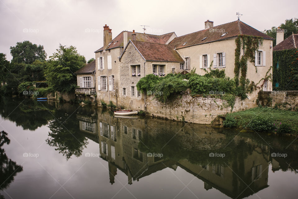 Cottages on the water in Noyers, France 