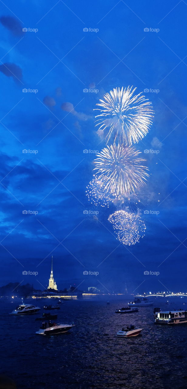Fireworks over the Neva river on the background of the fortness