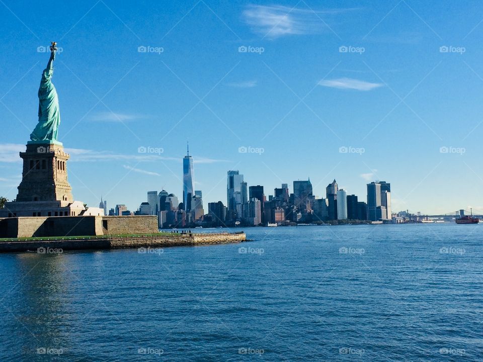 Statue of Liberty with NY skyline in background
