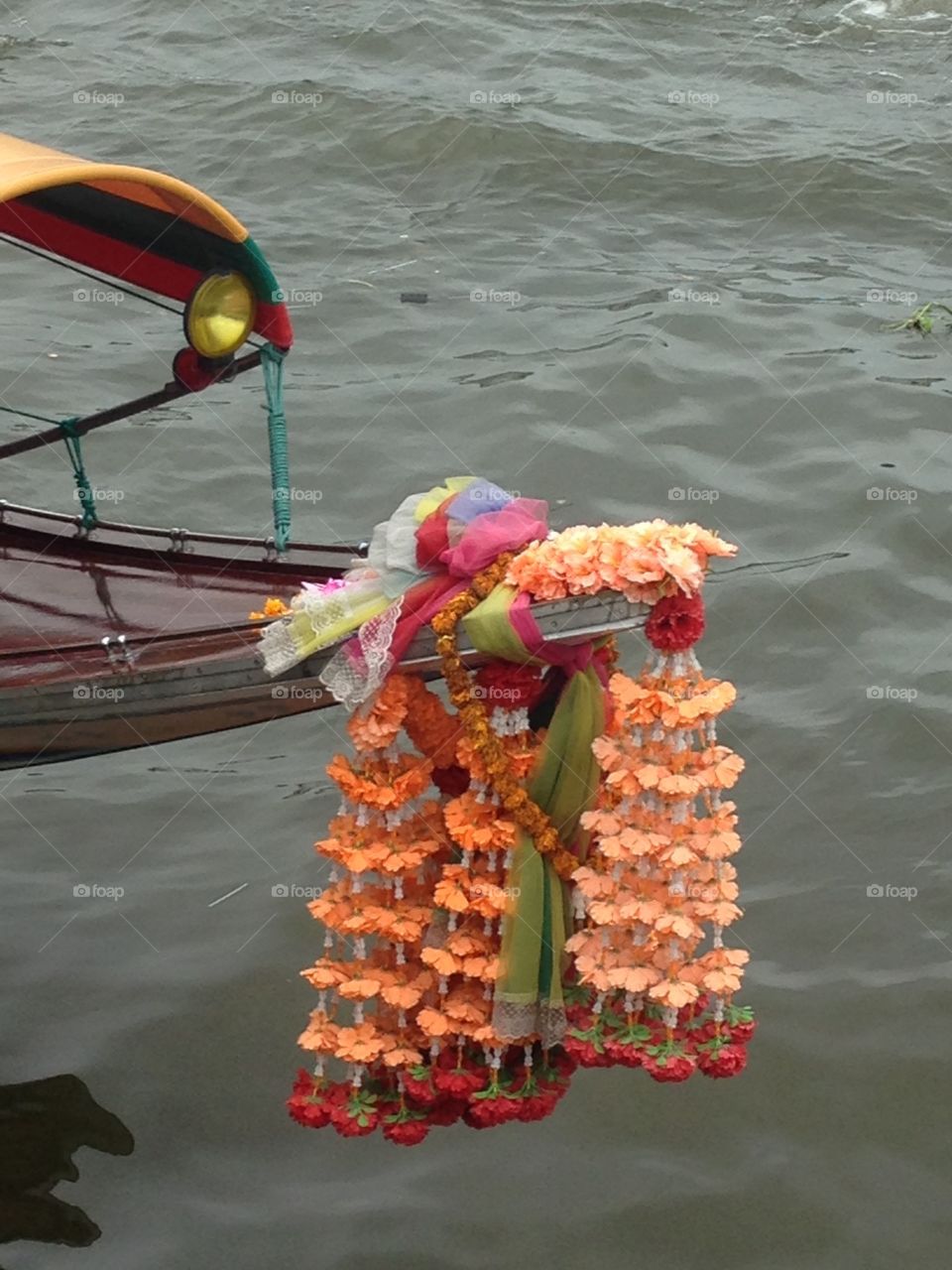 Flower garlands on long tail boat Thailand 
