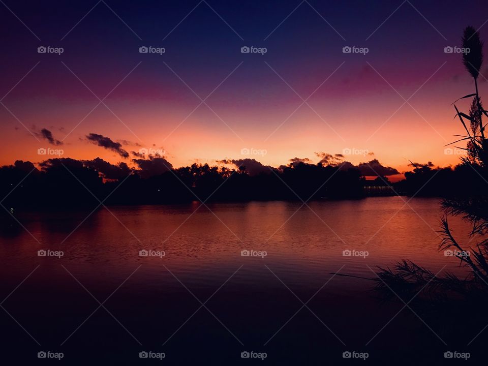 After the clouds encased the falling sun now disappearing into the increasing grateful appearing night. The cooling effects of the sun now giving off increasing Hues of a wide range of color to make the Sunset Complete.