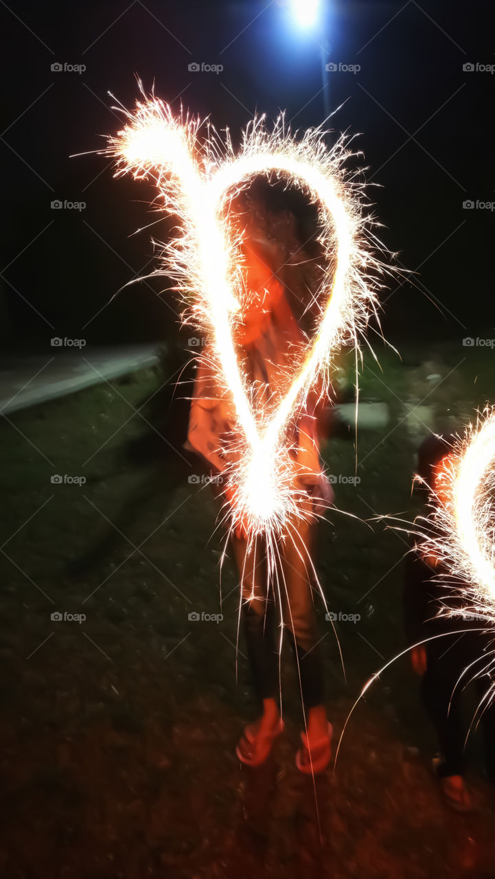 Children playing with sparklers in Diwali Festival night and enjoying Festival.