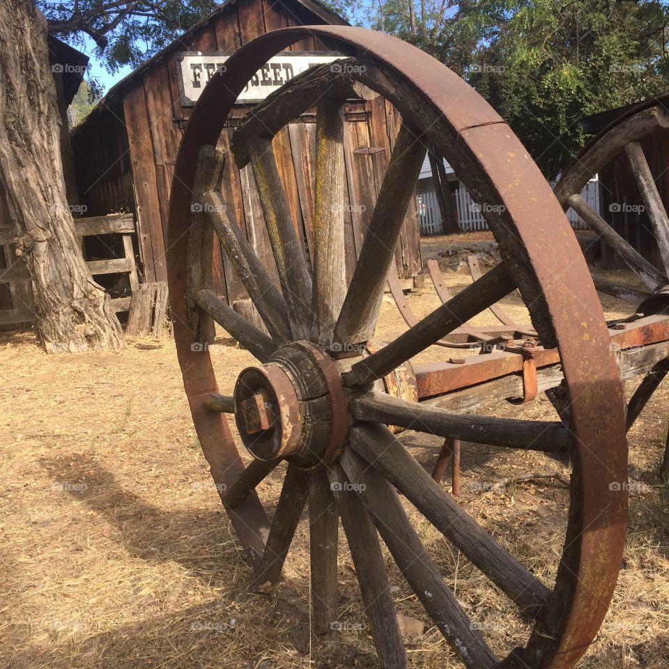 Old wagon wheel in a small town
