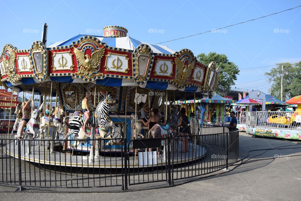 Carousel Ride. Children riding on the carousel at the fair.