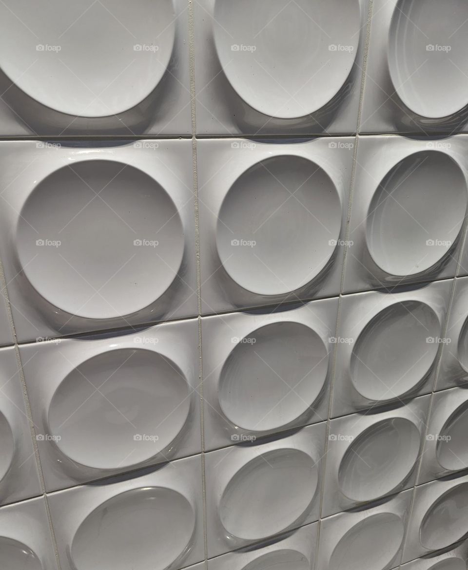 repeating white circles geometric wall pattern bar wall