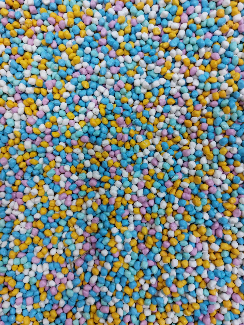 Baby blue pebbles besides full colors pebbles