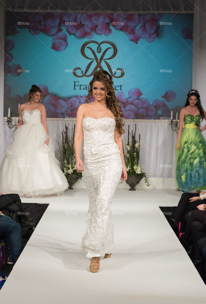 Fashion show at a wedding fair. Here are the latest dresses and clothes for both bride and groom.