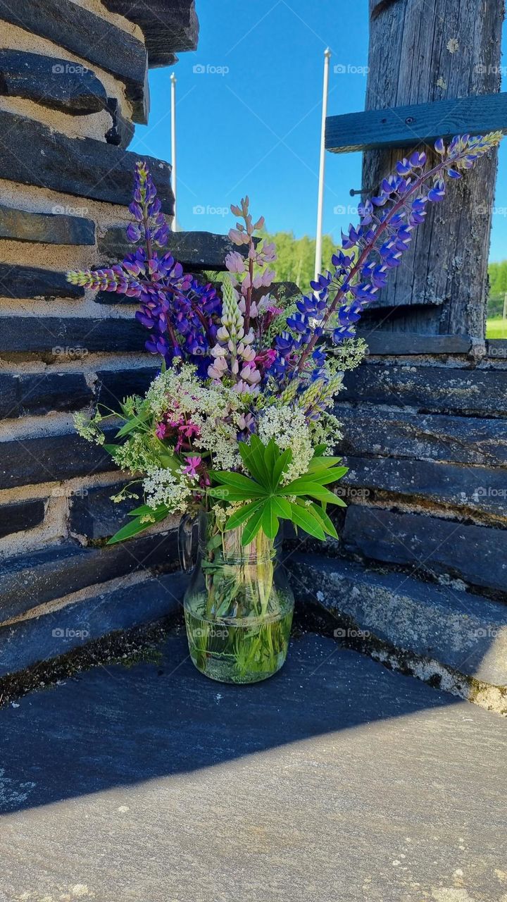 Beautiful summer flowers picked from Finnish nature in a vase.