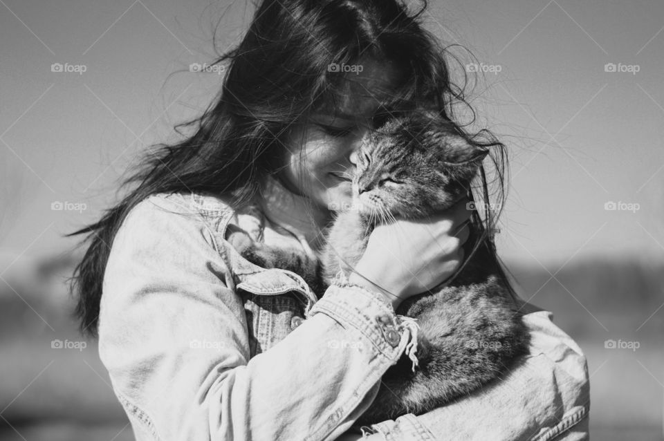 Young girl holding her Pet.