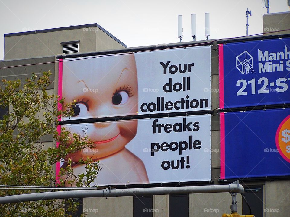 Billboard on outskirts of Tel Aviv, Israel; creepy doll