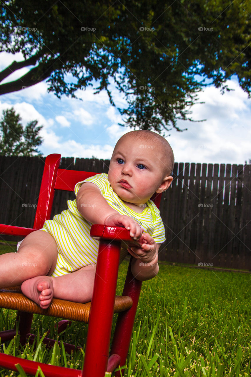 Baby in red chair