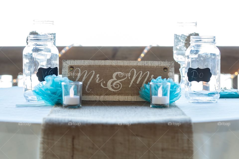 Bride and groom head table at wedding reception 