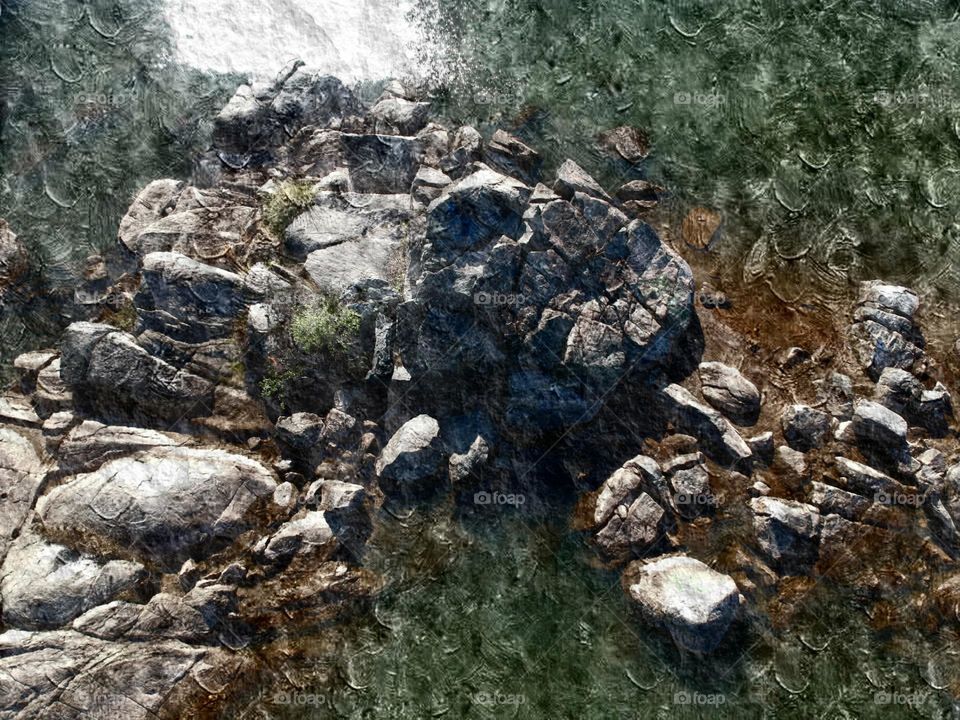 Overhead view of rocks in a river