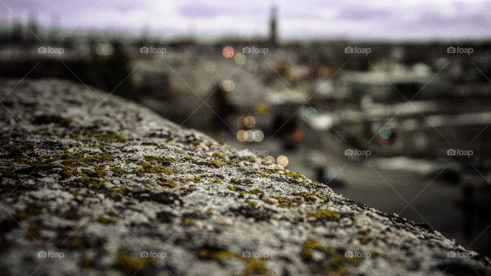 Macro of rooftop onto busting city.