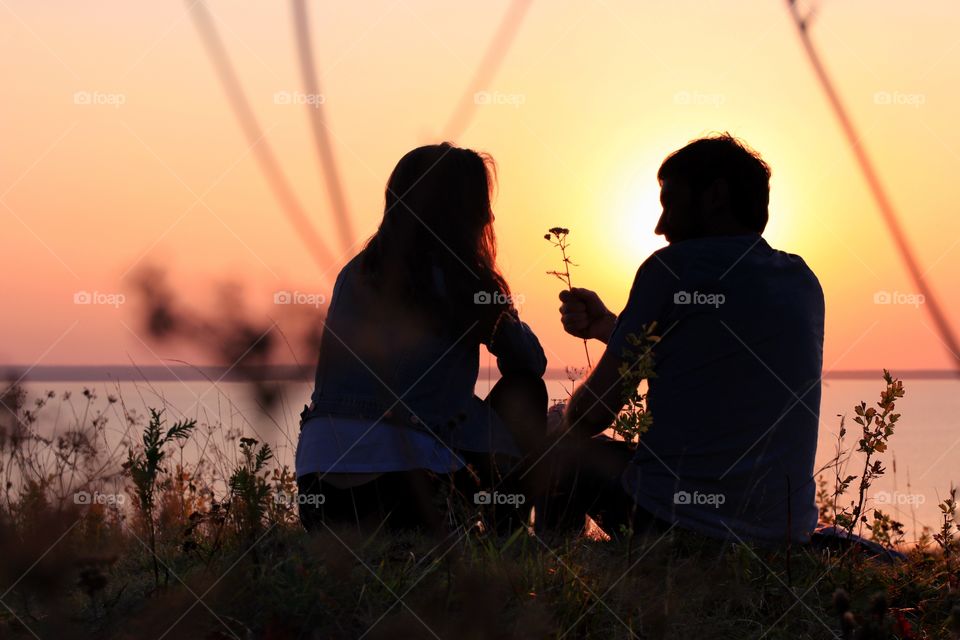 silhouette couple in love on the sunset