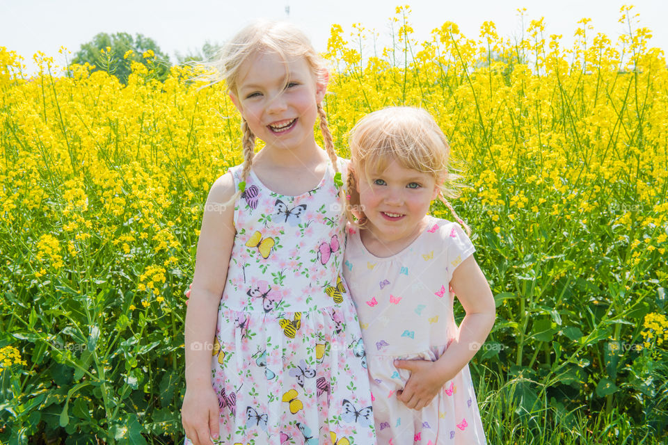 Two young sisters are playing in the Raps field outside the city Malmö in Sweden.