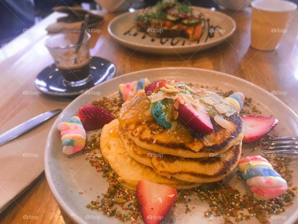 Welcoming a sweet day with a plate of colorful pancakes