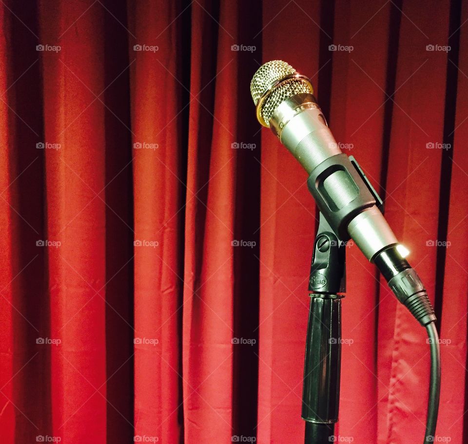 Microphone and red curtain. 