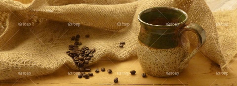 Cup of coffee with coffee beans